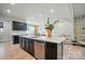 Modern kitchen island with sleek countertops and stainless steel appliances, perfect for food preparation and casual dining at 2533 Ensemble Ct, Charlotte, NC 28262