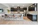 Spacious kitchen featuring black cabinets, a central island with seating, and modern stainless steel appliances at 2533 Ensemble Ct, Charlotte, NC 28262