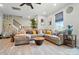 Bright living room with modern decor, comfortable seating, and a view of the stairs at 2533 Ensemble Ct, Charlotte, NC 28262