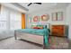 Inviting main bedroom features modern decor, tray ceiling, and lots of natural light at 2533 Ensemble Ct, Charlotte, NC 28262