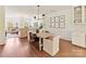 Bright dining room with modern decor, wood floors, and seamless flow to the kitchen and living spaces at 2621 Huntman Way, Charlotte, NC 28226