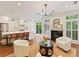 Bright living room features an open concept to kitchen and cozy fireplace at 2621 Huntman Way, Charlotte, NC 28226