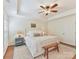 Bright main bedroom with tray ceiling, decorative bedside lamps and neutral color palette at 2621 Huntman Way, Charlotte, NC 28226