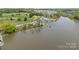 Aerial view showcasing lakefront properties with private docks and community amenities in a serene setting at 291 Preston Rd, Mooresville, NC 28117