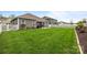 Spacious backyard with a patio, well-kept lawn, and white picket fence at 291 Preston Rd, Mooresville, NC 28117