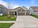 Charming two-story home with three-car garage and well-manicured lawn in a desirable neighborhood at 291 Preston Rd, Mooresville, NC 28117