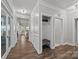 Hallway features wood floors, a mudroom, and access to multiple rooms at 291 Preston Rd, Mooresville, NC 28117