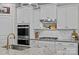 Gourmet kitchen with granite countertops, stainless steel appliances, and ample cabinet space at 291 Preston Rd, Mooresville, NC 28117