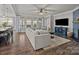 A spacious living room with a sectional couch and multiple windows for natural light at 291 Preston Rd, Mooresville, NC 28117