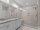 Main bathroom with double sink vanity and glass shower at 291 Preston Rd, Mooresville, NC 28117