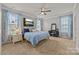 The main bedroom features two windows and a television at 291 Preston Rd, Mooresville, NC 28117