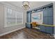 Spacious office with custom built-ins, a large window, and hardwood floors, perfect for working from home at 291 Preston Rd, Mooresville, NC 28117