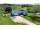 Aerial view of a charming home with a well-manicured lawn and long driveway at 4808 Thoreau Dr, Conover, NC 28613