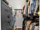 Walk-in closet with a built-in Winchester safe and custom organizers at 4808 Thoreau Dr, Conover, NC 28613