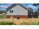 Side view of home features siding, brick foundation, back deck and green grass at 4808 Thoreau Dr, Conover, NC 28613