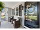 Inviting covered front porch with charming decor, seating, and a decorative wreath on the front door at 4808 Thoreau Dr, Conover, NC 28613