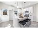 Contemporary kitchen showcasing an island with seating and a view of the backyard at 4827 Victoria Ave, Charlotte, NC 28269