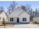 Charming home featuring a covered front porch and manicured lawn at 4907 Victoria Ave, Charlotte, NC 28269