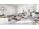 Bright, open-concept living area with modern furnishings and natural light, seamlessly connected to a stylish kitchen at 4907 Victoria Ave, Charlotte, NC 28269