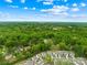 A picturesque aerial view of a residential neighborhood with tree-lined streets and well-maintained homes at 509 Carole Ln, Charlotte, NC 28214