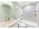 Bathroom with tiled shower-tub and marble topped vanity at 509 Carole Ln, Charlotte, NC 28214