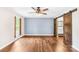 Bedroom featuring an accent wall and a barn door leading to the ensuite bathroom at 509 Carole Ln, Charlotte, NC 28214