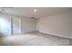 Spacious bedroom featuring neutral walls, plush carpet, and ample natural light at 580 N Sparkleberry St, Chester, SC 29706