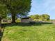 Spacious backyard featuring a shed and mature shade trees, ideal for outdoor activities at 714 S 8Th St, Bessemer City, NC 28016