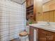 Functional bathroom with wood paneling, shower, and vanity at 714 S 8Th St, Bessemer City, NC 28016
