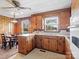 Classic eat-in kitchen with wood cabinets, white countertops, and natural light at 714 S 8Th St, Bessemer City, NC 28016