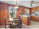Eat-in kitchen featuring wood cabinets and natural light at 714 S 8Th St, Bessemer City, NC 28016