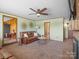 Open living area includes a fireplace, ceiling fan, and an inviting seating area at 714 S 8Th St, Bessemer City, NC 28016