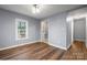 Bedroom featuring wood-look floors, soft gray walls, and natural light at 728 21St Sw St, Hickory, NC 28602