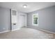 Bright bedroom with new carpet, a window for natural light, and a closet for storage at 728 21St Sw St, Hickory, NC 28602