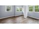 Spacious bedroom with large windows offering ample natural light and new vinyl plank floors at 728 21St Sw St, Hickory, NC 28602