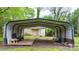 Large metal carport for vehicle storage and protection, with a shed in the background at 728 21St Sw St, Hickory, NC 28602