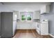 Bright kitchen featuring white cabinets and appliances at 728 21St Sw St, Hickory, NC 28602