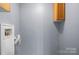 Functional laundry area with utility hookups and cabinet for storage convenience at 728 21St Sw St, Hickory, NC 28602