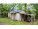 Shed with an awning, with materials under it. In need of repair or renovation at 728 21St Sw St, Hickory, NC 28602