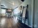 Inviting dining area featuring a cozy fireplace, wood floors, and stylish decor creating a warm ambiance at 835 Leach Rd, Salisbury, NC 28146