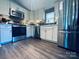 Modern kitchen featuring stainless steel appliances, white cabinets, and sleek countertops, a chef's dream at 835 Leach Rd, Salisbury, NC 28146