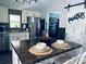 Stylish kitchen with a spacious island, stainless steel appliances, and a pantry door for seamless organization at 835 Leach Rd, Salisbury, NC 28146