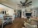 Open-concept living space with hardwood floors, ceiling fan, and easy access to the kitchen and dining area at 835 Leach Rd, Salisbury, NC 28146