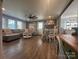 Cozy living room with fireplace, fan, dining area and hardwood floors provides ample space at 835 Leach Rd, Salisbury, NC 28146