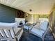 Inviting screened porch with comfortable seating and a cozy fireplace at 835 Leach Rd, Salisbury, NC 28146