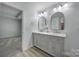 Bathroom featuring double sinks, modern lighting, and wood look floors at 861 Watling St, Fort Mill, SC 29715
