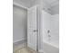 Bathroom with a white tub and shower combination, next to a white door at 861 Watling St, Fort Mill, SC 29715