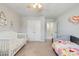 Bright bedroom with two beds, neutral carpet, ceiling fan, and double closet doors at 861 Watling St, Fort Mill, SC 29715