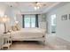 Well-lit bedroom with an ensuite bathroom, large window, and neutral decor at 861 Watling St, Fort Mill, SC 29715
