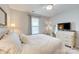 Bedroom with a window, bedside tables, lamps, dresser, and an accent chair at 861 Watling St, Fort Mill, SC 29715